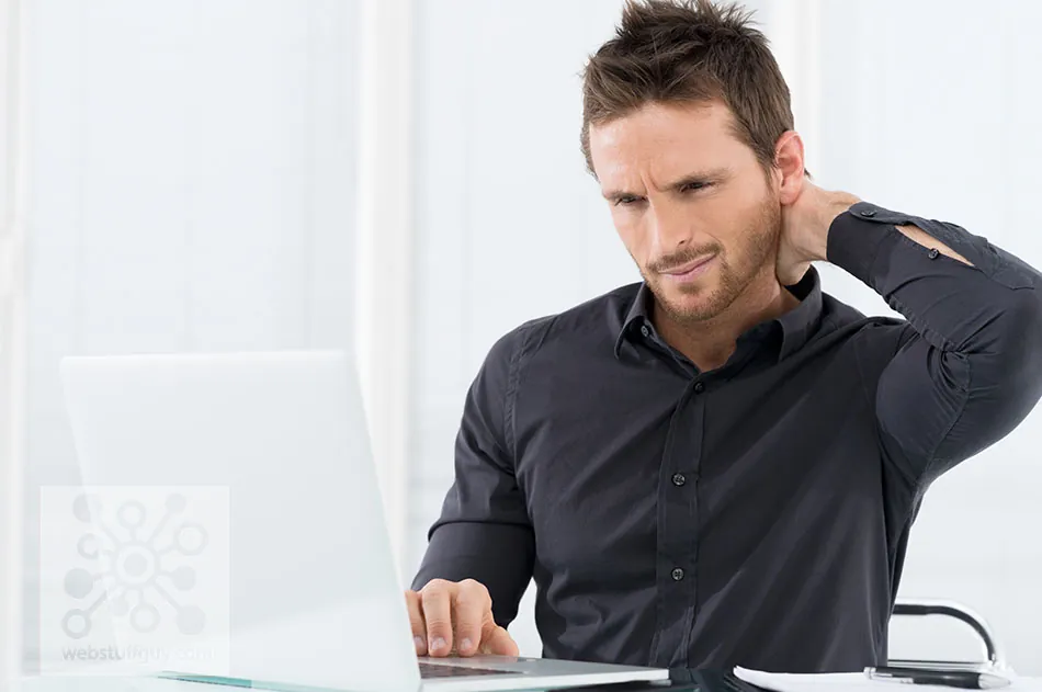 A frustrated business owner reading an email on a laptop